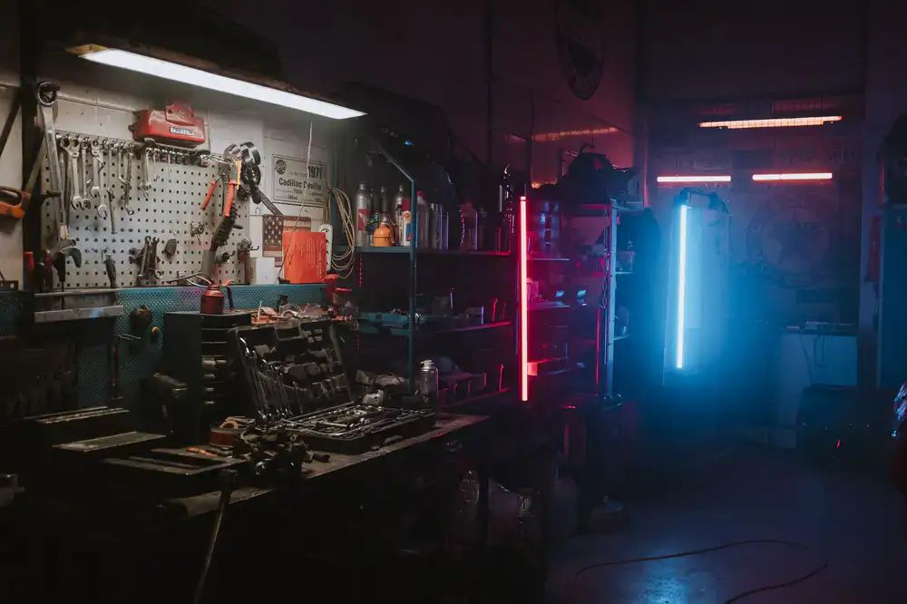 Wide view of a clean, modern electric bike service workshop with organized tool walls