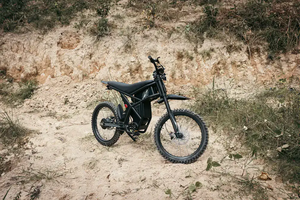 Rugged electric bike parked on a gravel trail